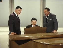 The Sherman brothers with Walt Disney